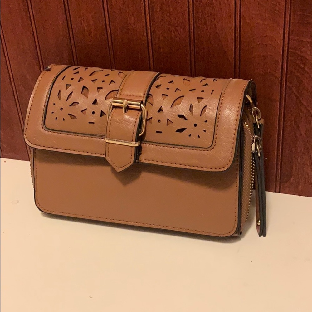 Tan cross body bag with laser cut out print